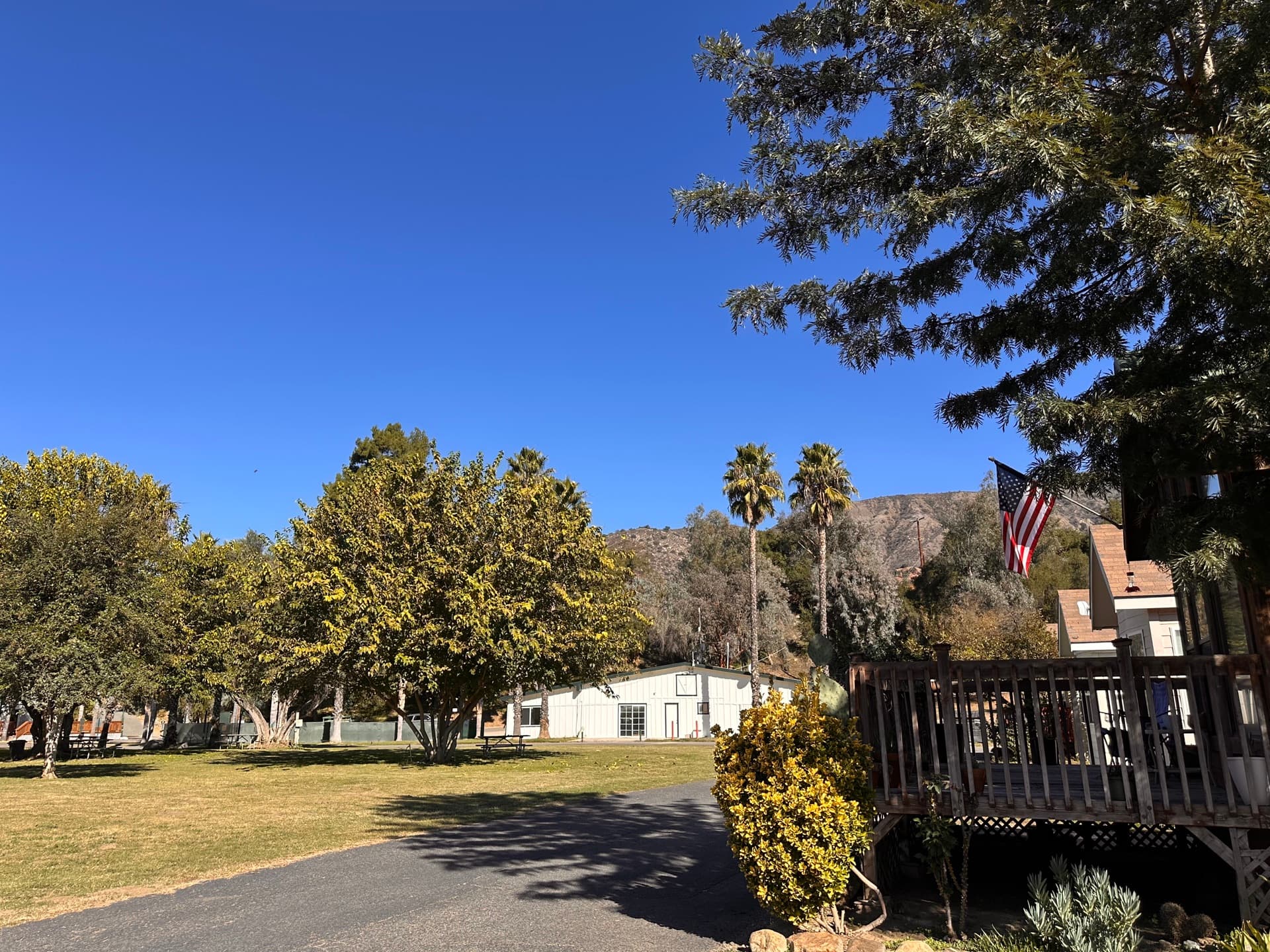 Park grounds and American flag at Rancho Corrido Pauma Valley